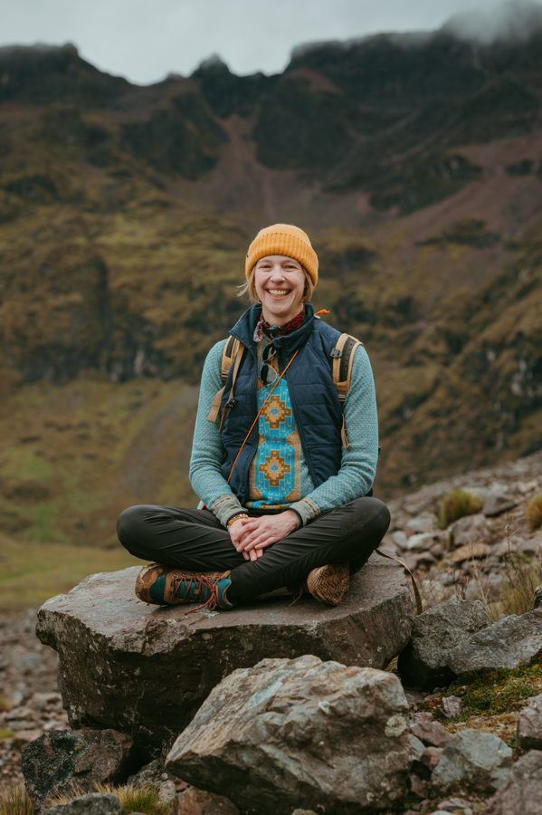 Colleen smiling on a mountain trail
